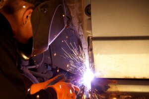 Mobile welding technician performing structural repair on-site in Idaho