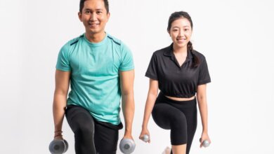 A man is training with a female personal trainer singapore