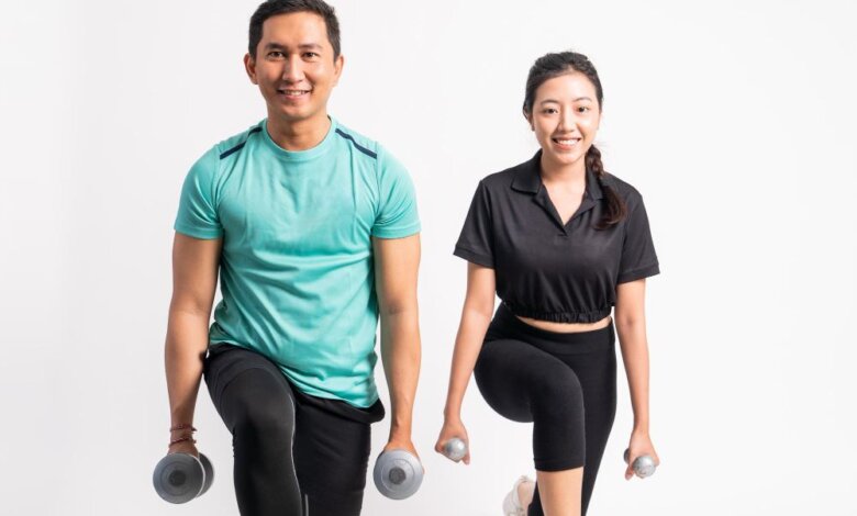 A man is training with a female personal trainer singapore