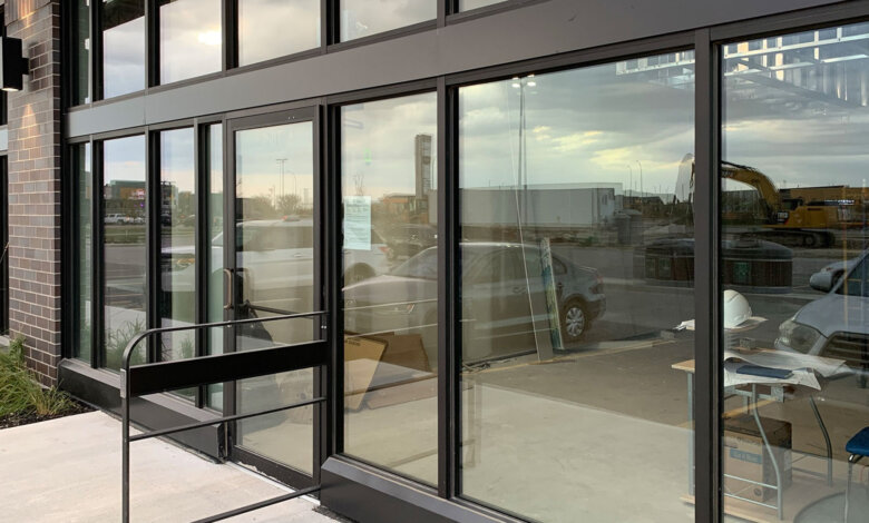 Shopfront Installation Service team fitting modern aluminium storefront