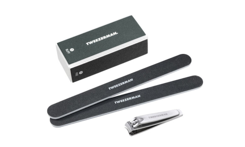 Tweezerman stainless steel cuticle trimmer held by NYC user
