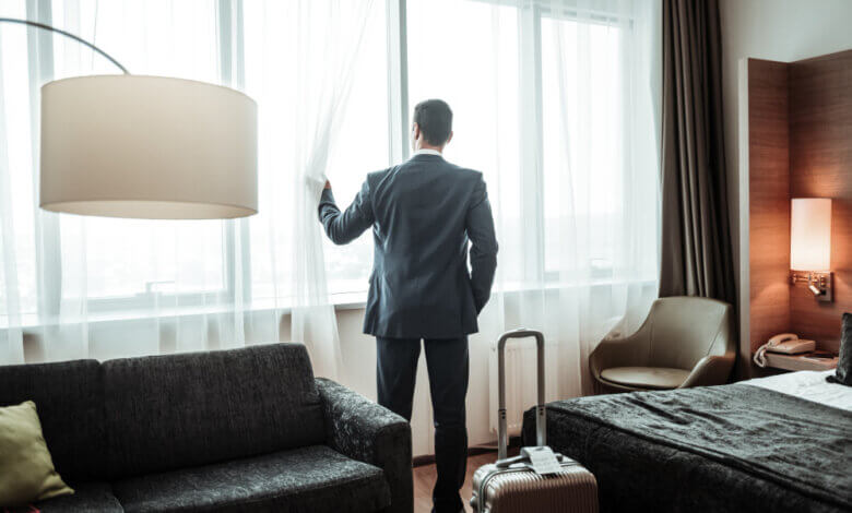 man in hotel room