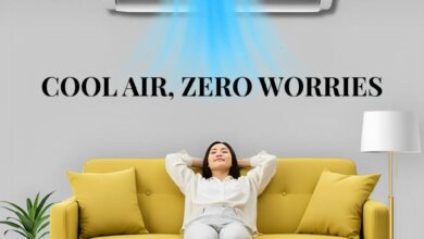 A woman relaxes on a yellow couch as cool air from an ASSAISH AC flows, with text "COOL AIR, ZERO WORRIES