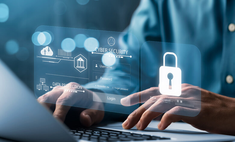 A person interacting with a holographic cybersecurity login interface featuring username and password fields, a lock icon, and data protection symbols, displayed over a laptop keyboard.
