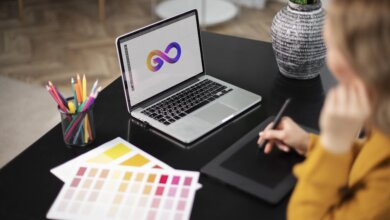 female-logo-designer-working-her-tablet-connected-laptop