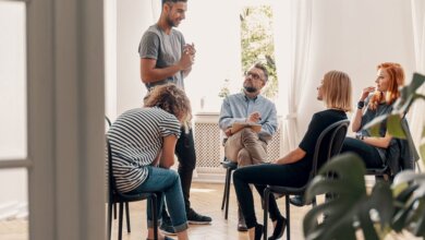 group-therapy-session-man-standing