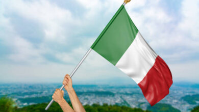 person hold Italy flage