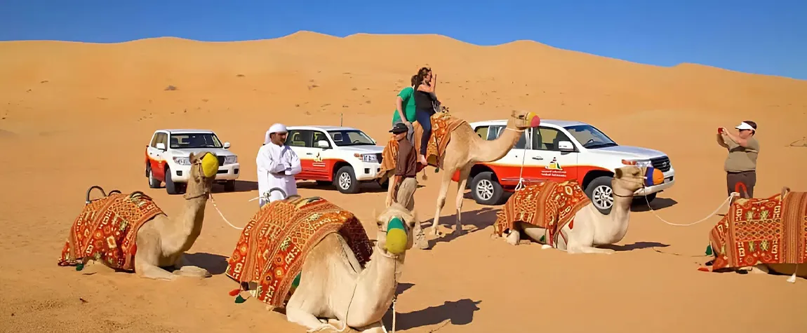 Dubai Desert Safari with dune bashing SUV, camel ride, and golden sand dunes under a sunset sky